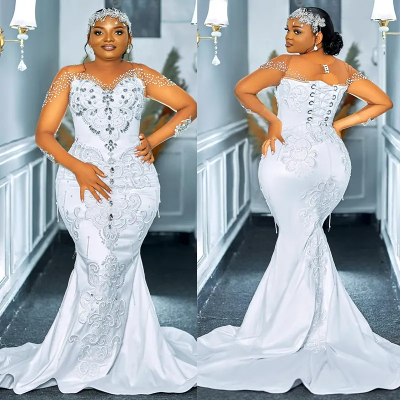 Plus Size Africano Arabo Aso Ebi Illusion Tromba Abito da sposa per la sposa Collo trasparente Tulle Pizzo Maniche lunghe Abiti da sposa Sirena Elegante Abito da sposa in rilievo CDW185