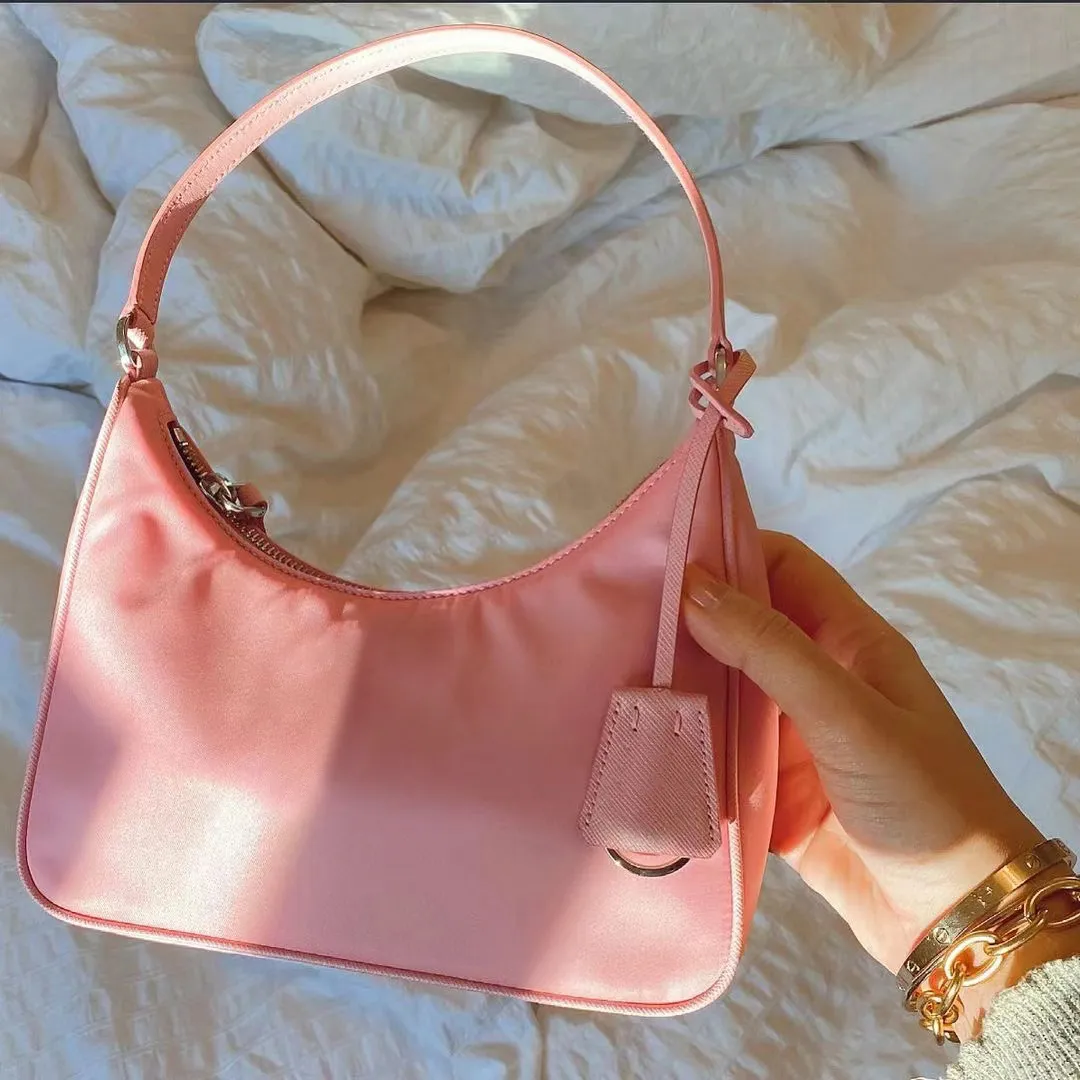 Moda omuz naylon koltuklu çanta kadın erkek çanta ve el çantası lüks debriyaj tote crossbody çantaları gerçek deri seyahat pembe tasarımcı çanta