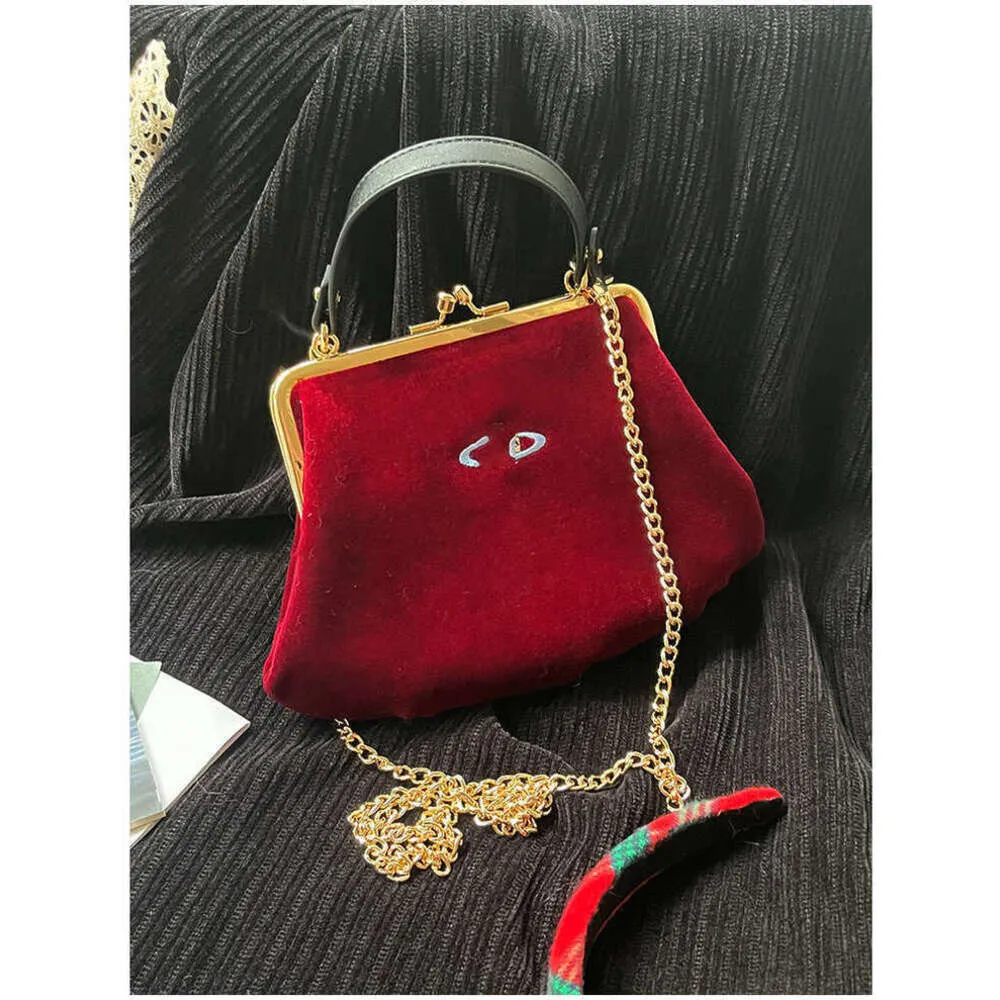 24SS Designer Viviane Westwoods Borsa Viviennewestwood Autunnoinverno Nuova cena Moda Saturn Borsa con clip in velluto ricamato West Empress Dowager Bocca Gnocco d'oro