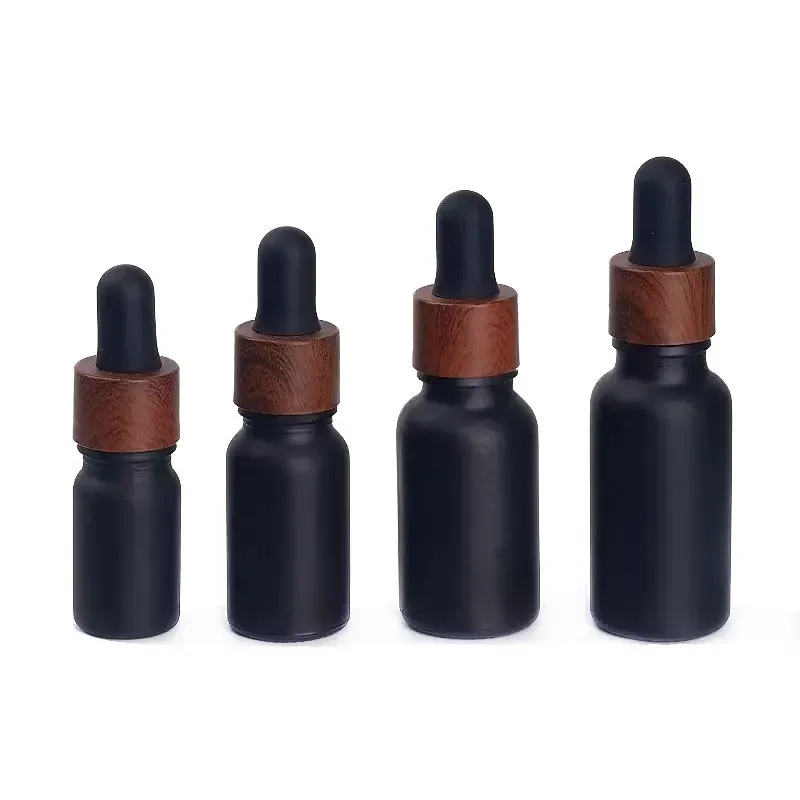 En gros flacons compte-gouttes en verre dépoli noir bouteille de parfums d'huile essentielle avec bouchon en plastique grain de bois 5 ml à 100 ml LL