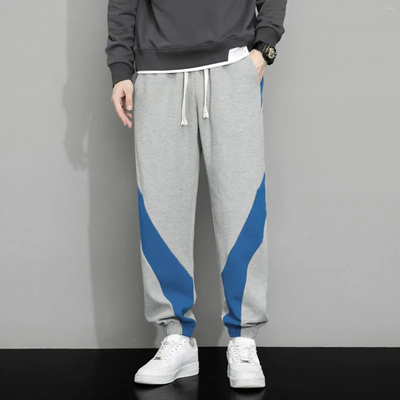 Mäns byxor Spring och Autumn Fashion Color Blocking Casual Sports Loose Drawstring Elastic Midje Sweatpants med fickor