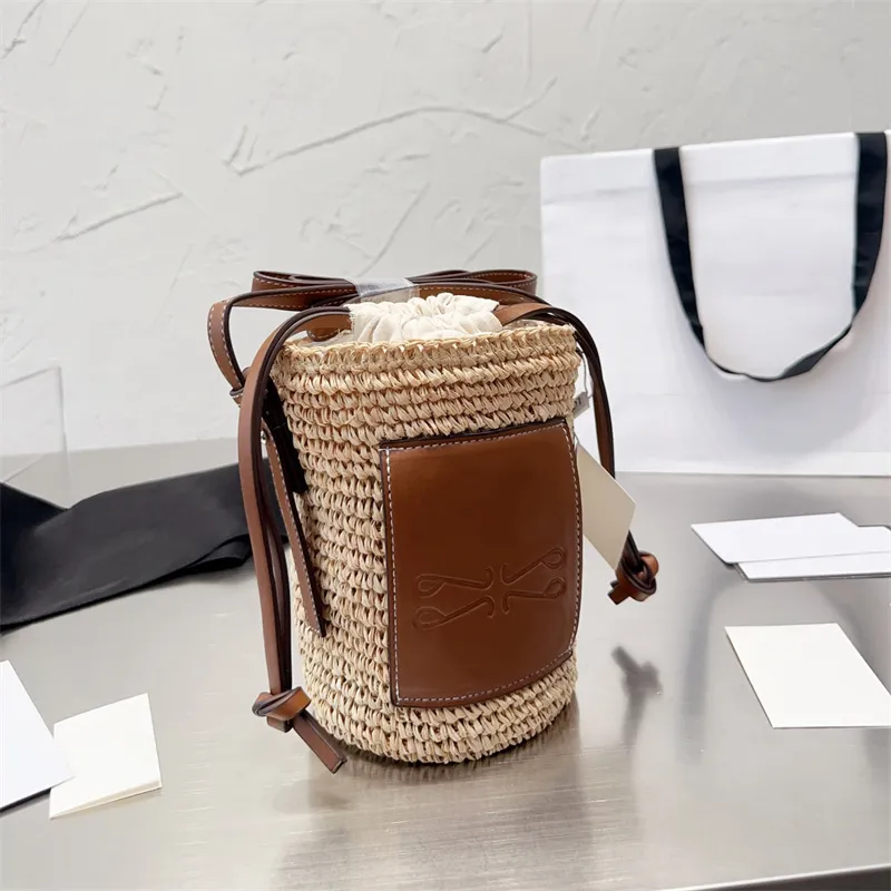 Diseñador de moda Bolsos de hombro Marcas de lujo de moda Mini bolso de cubo para hombre Mujer Verano Casual Vacaciones Bolsas de paja Bolso de cesta Monederos