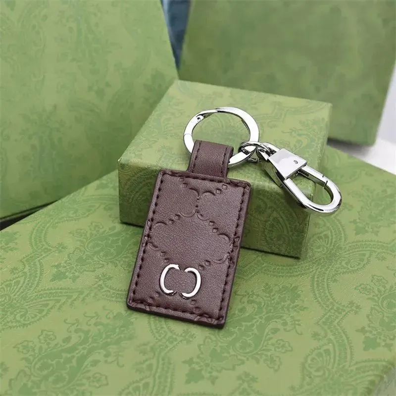 DHgate.com:Gold Buckle Keychain for Men and Women, Classic Letter ...