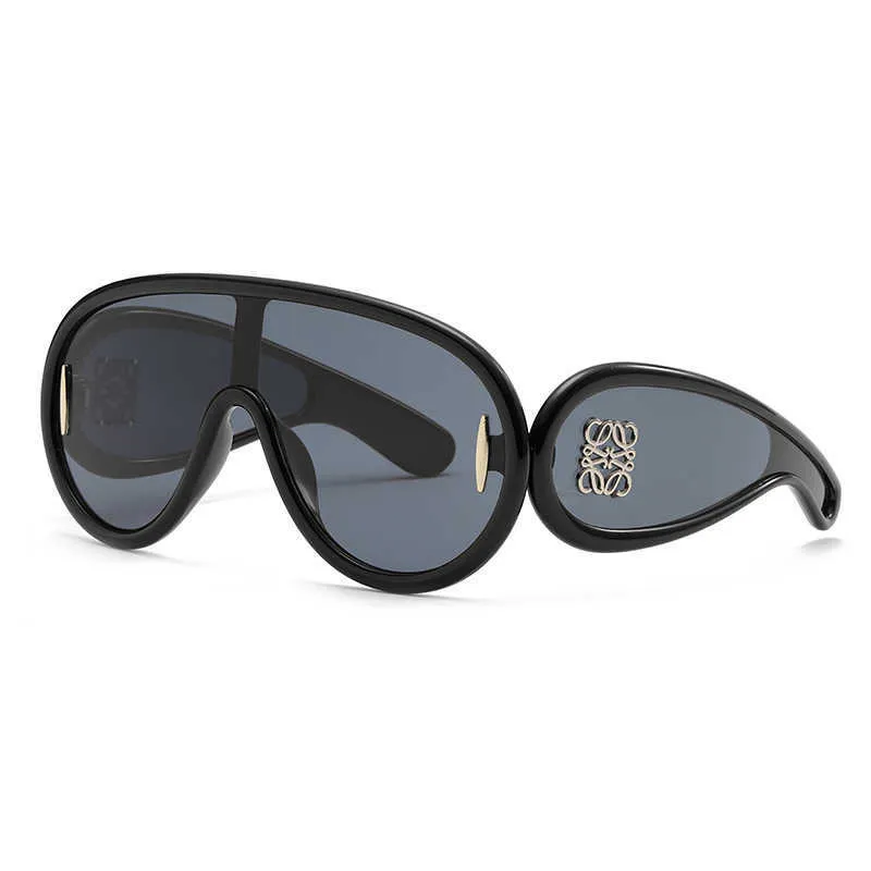 DHgate Wholesale of sunglasses 23014 New Wing Style One Piece Fashion Women s Advanced Sense Travel Personalized Sunglasses Fashion Accessories