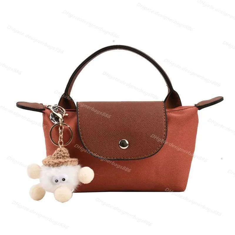 High quality Clearance Wholesale wallet Nylon Dumpling Bag Wholesale 2024 Short Handle Hand Contrast Cosmetic Cognac Color Hand Mini handbag