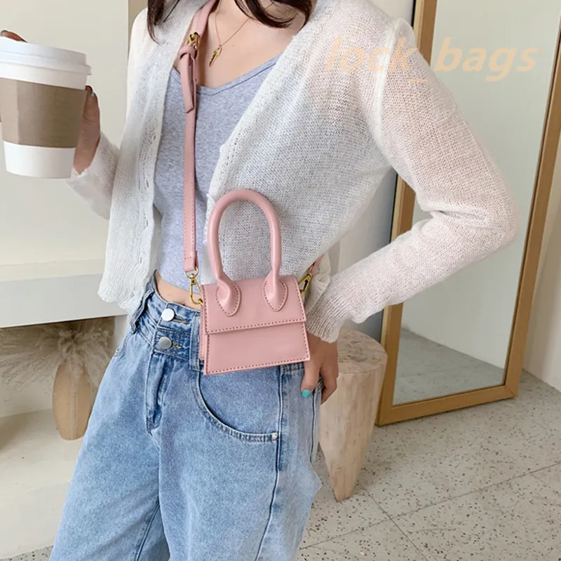 Diseñador de alta calidad bolso de mujer bolso cruzado hebilla de hombro diseño redondo marca de lujo al aire libre blanco rosa suave pequeña capacidad mini bolso 2023