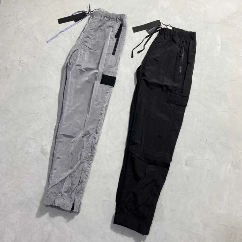 Дизайнеры брендов брюки каменные металлические нейлоновые карманные вышитые значки повседневные брюки Тонкие отражающие островные приливные расчет 549ess