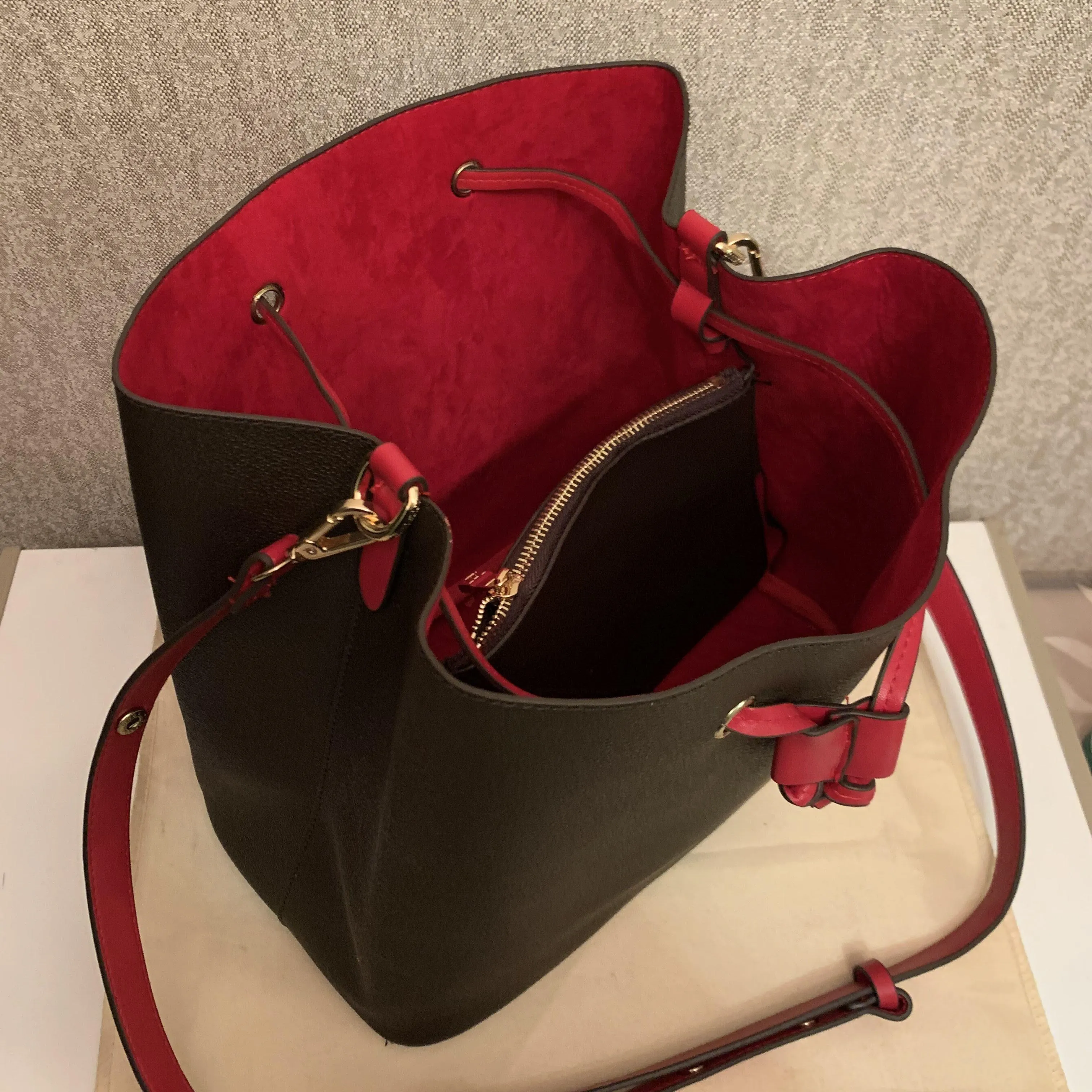 Black leather bag with red interior hotsell