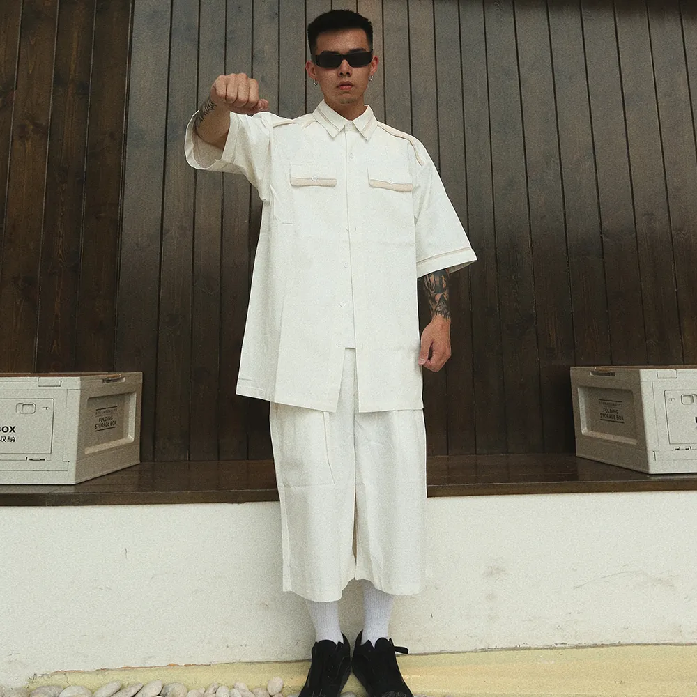 Мужские спортивные костюмы летние футболки и шорты на футболках для мужчин белая черная уличная одежда повседневная спортивная костюма Harajuku Lapel Tops негабаритный хип -хоп 230707