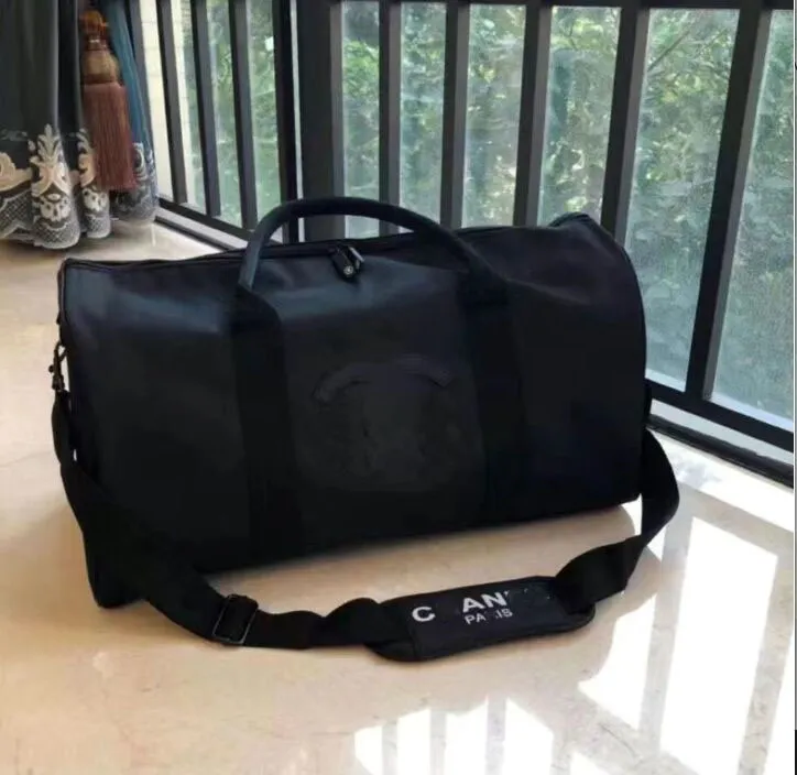 högkvalitativt lyxmode män kvinnor resor duffle bags märke designer bagage handväskor stor kapacitet sport Duffel bag 45*25-21cm