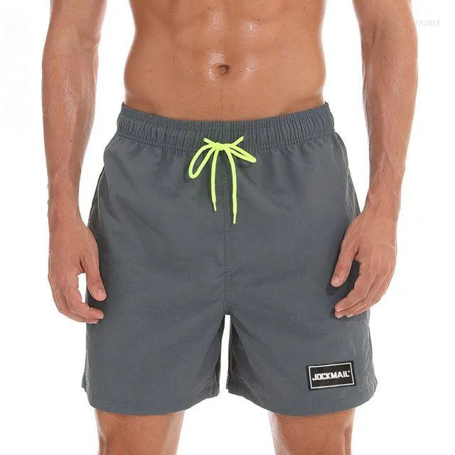 Herrshorts JOCKMAIL Märke 2023 Stretchbadbyxor Quick Dry Beach med fickor och meshfoder Baddräkt Herrtrosor