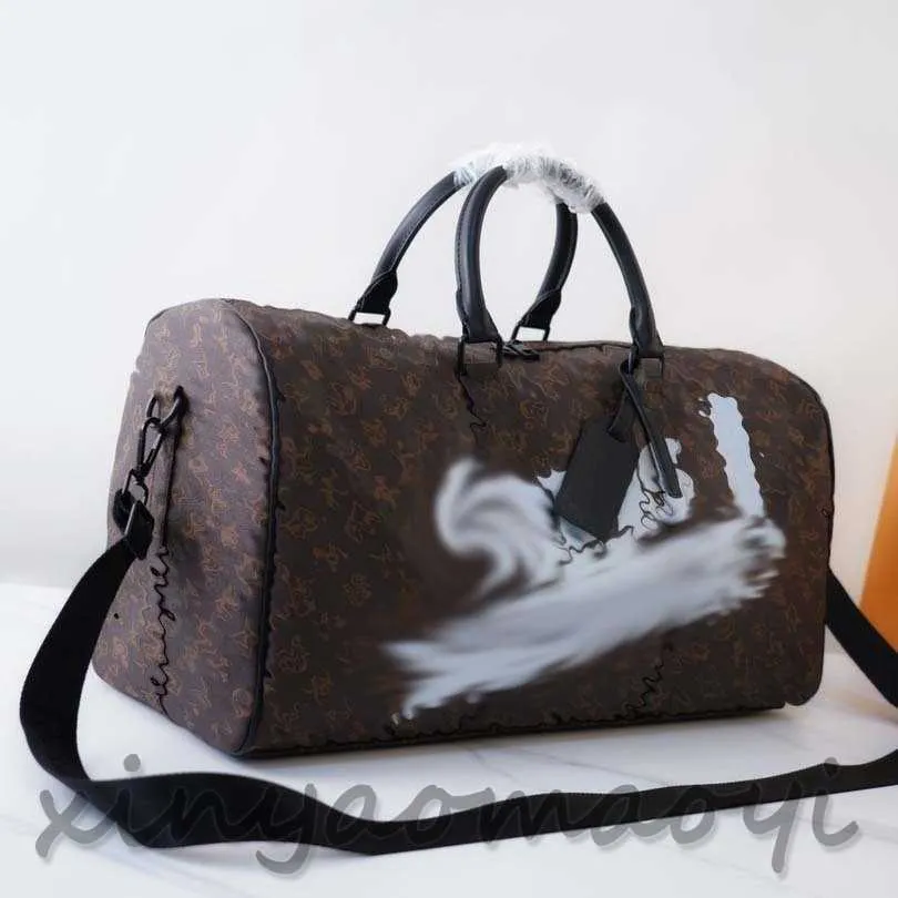 Yüksek kaliteli yüksek versiyon tasarımcısı lüks çantalar büyük kapasiteli duffel çanta unisex moda seyahat çantası sırt çantası klasik eski desen karikatür desen