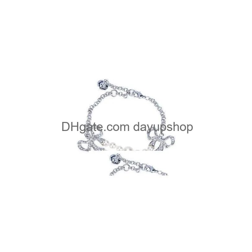 Charm Bracelets Western Empress Douairière Vivienne Double Couche Perle Diamant Bowknot Vivian Bracelet Ins Advanced Sense Drop Delivery Dha8J