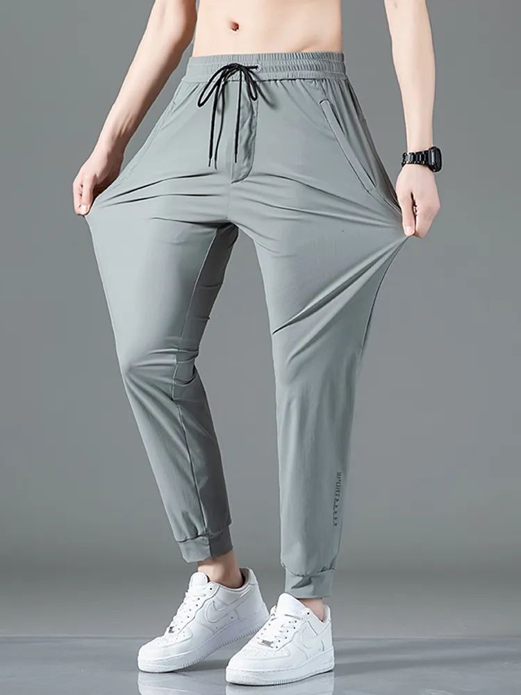 Mężczyzn Summer Letnie kieszenie na suwak joggery Szybkie suche spodnie dresowe Oddychane oddech Nylon Slim Track Męskie Sporty Męskie Sport 8xl 230713