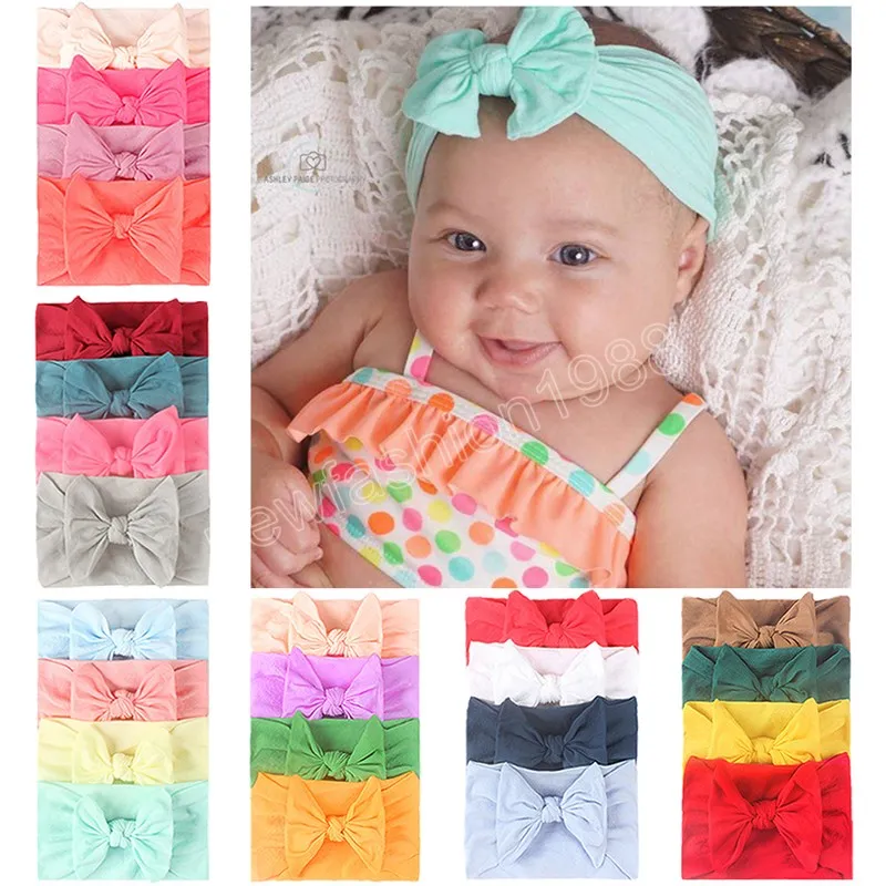 4st/Lot Fashion Soft Elastic nylon pannband baby flickor solid färg bowknot hårband nyfödda huvudbonnar hårtillbehör