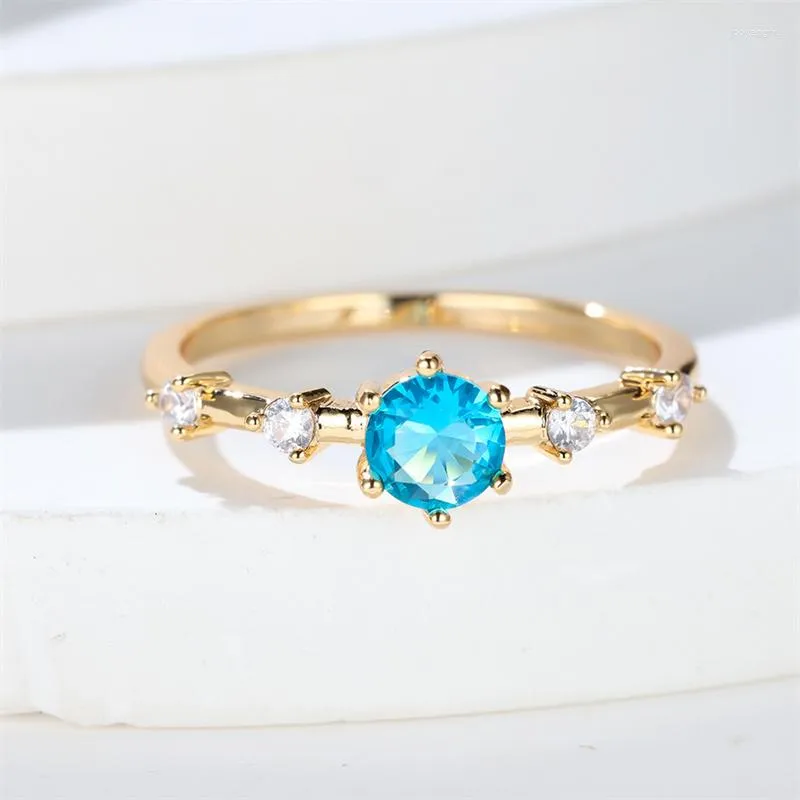 Anneaux de mariage luxe femme charme eau bleu Zircon anneau couleur or jaune pour les femmes ronde cristal pierre fiançailles bijoux