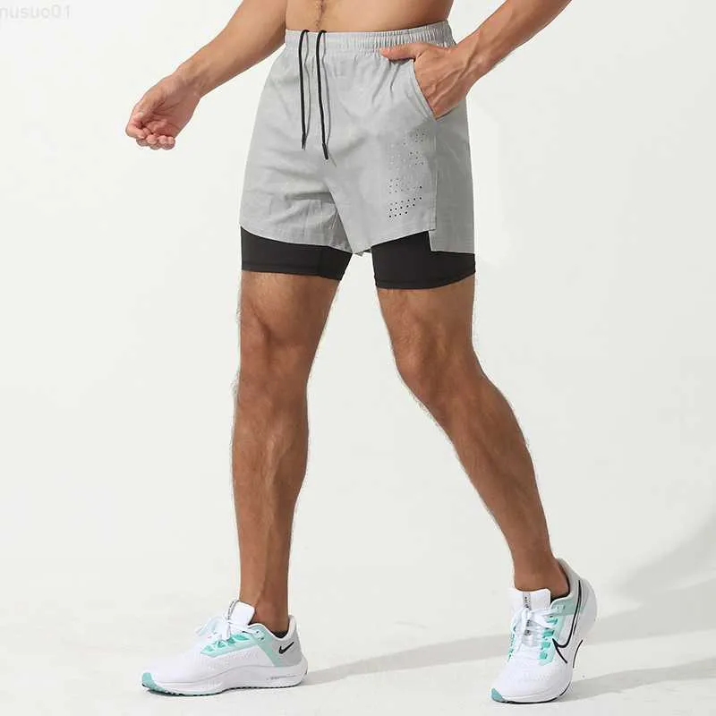 Mäns shorts Summer Sports Shorts Män Fake Two Piece Light and Tight Elastic Basket Basket Kör snabbt torkande dubbelskikt Fitness Pants L230719