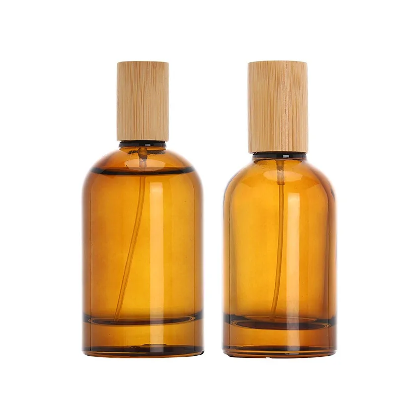 Bouteilles d'atomiseur de parfum Pompe à sertir Couvercle en bois 1 oz 2 oz 3 oz Emballage cosmétique portable Flacons d'échantillon Vide Bouteille rechargeable en verre brun 30 ml 50 ml 100 ml