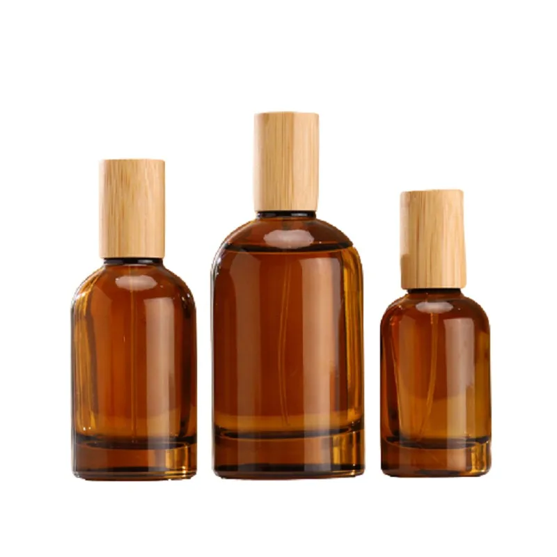 Bouteilles d'atomiseur de parfum Pompe à sertir Couvercle en bois 1 oz 2 oz 3 oz Emballage cosmétique portable Flacons d'échantillon Vide Bouteille rechargeable en verre brun 30 ml 50 ml 100 ml