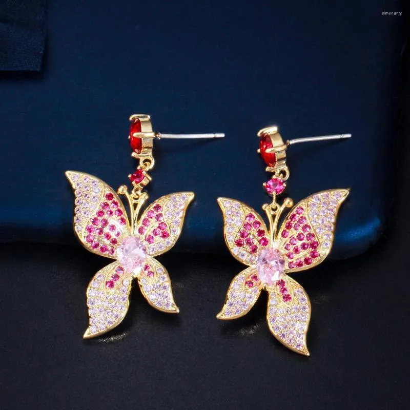 Orecchini pendenti ThreeGraces Shiny Pink Red CZ Zircon Gold Color Luxury Dangling Butterfly Drop Per le donne Bigiotteria per feste E1185