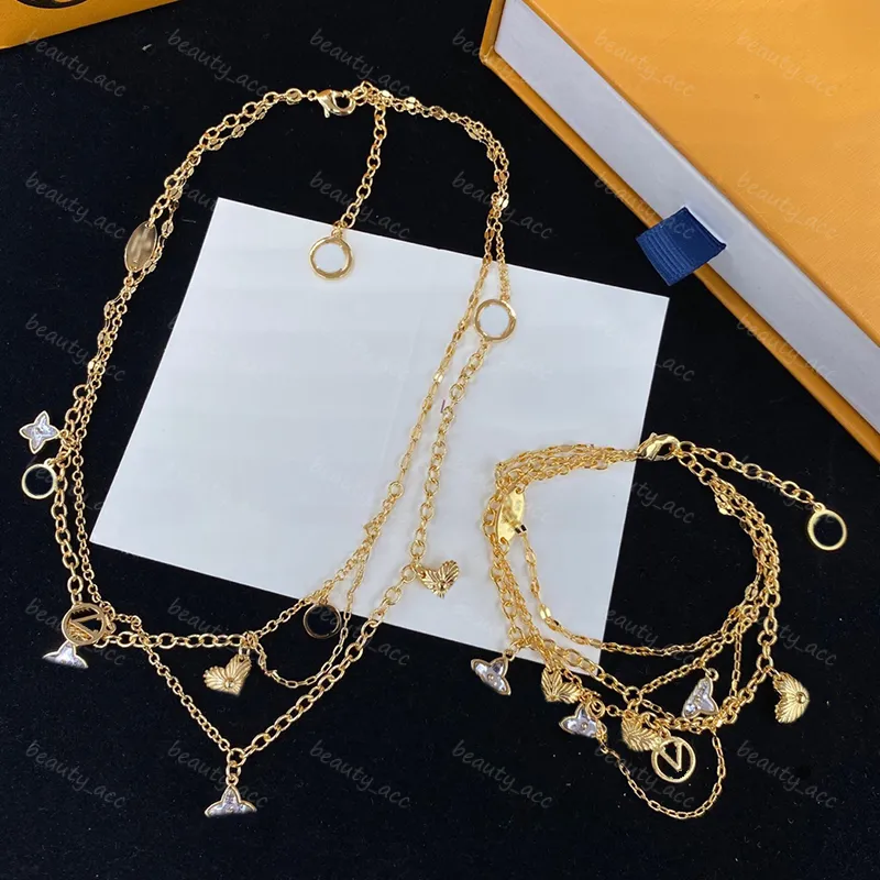 Womens Designer Ketting Bloem Armband Mode Sieraden Set Gouden messing Gegraveerde V Initialen Kettingen Charm Armbanden Sprankelende bruid cadeau