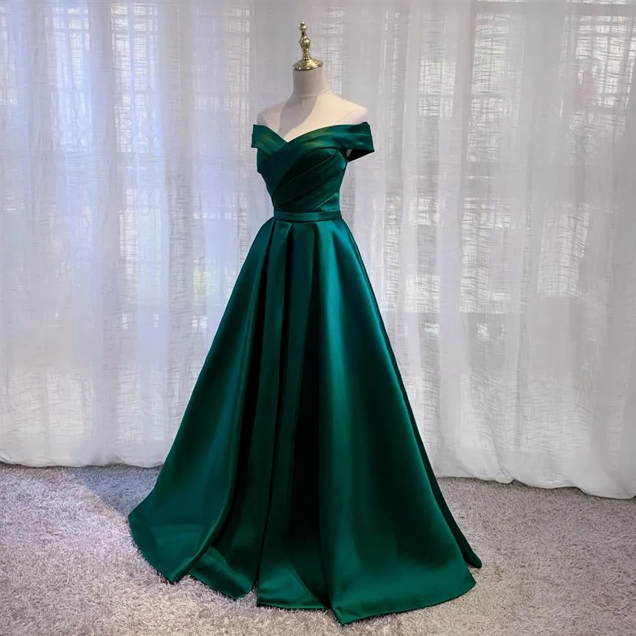 Green satin evening hot sale gown