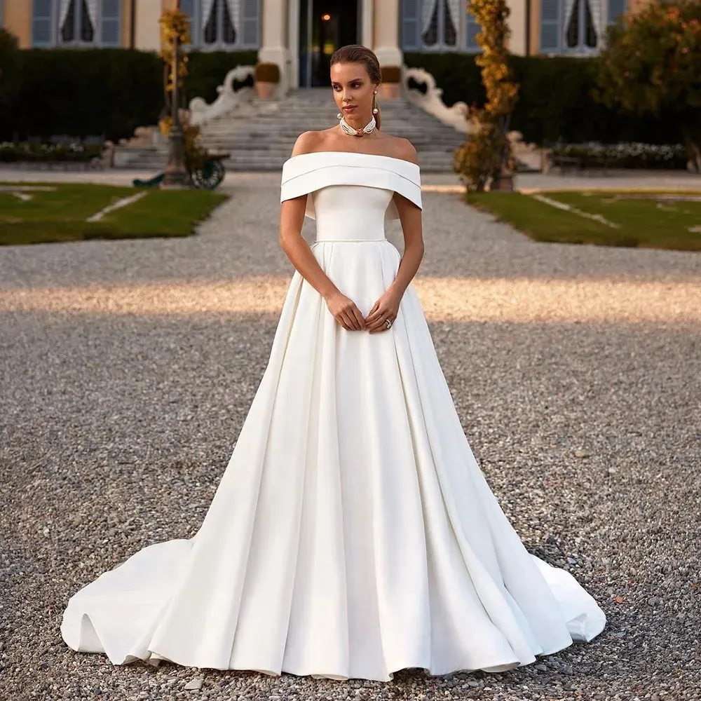 Doymeny Abiti da sposa a trapezio bianchi in raso con spalle scoperte Abito da festa nuziale 2023 Abito con tasche