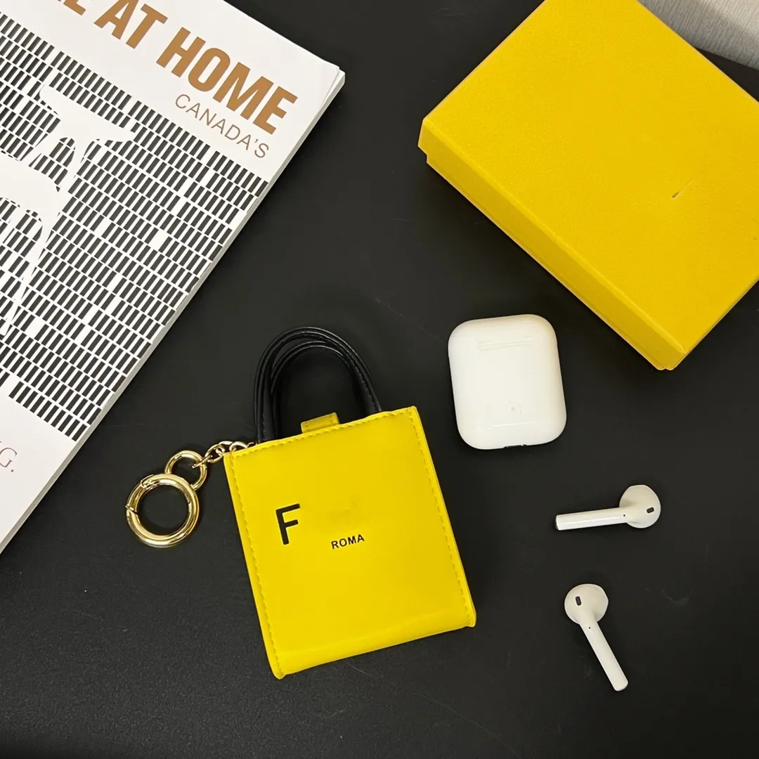 Tasarımcı çantaları unisex anahtar cüzdan sarı harf madeni para cüzdanları anahtarlık kadın ve erkek mini tote çanta kulaklık çantası asılı lüks marka omuz çanta totes anahtarlık takılar