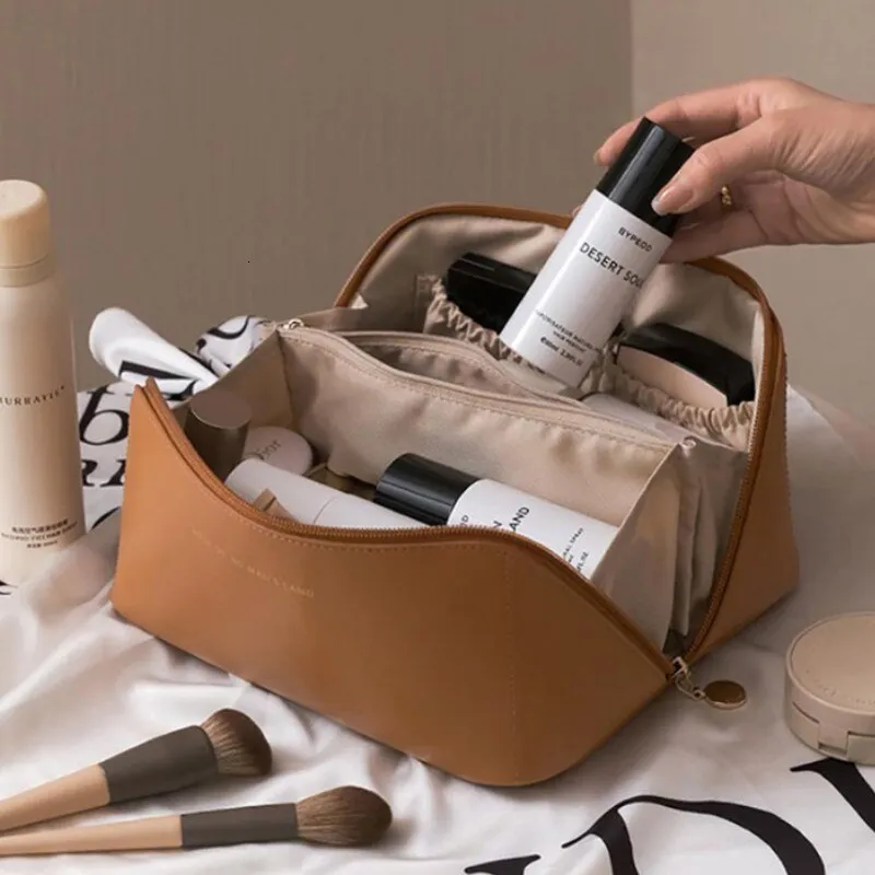 Bolsas de cosméticos Estuches Bolsa de viaje de gran capacidad Portátil de cuero para mujer Baño Lavado Kit de aseo multifuncional 230725