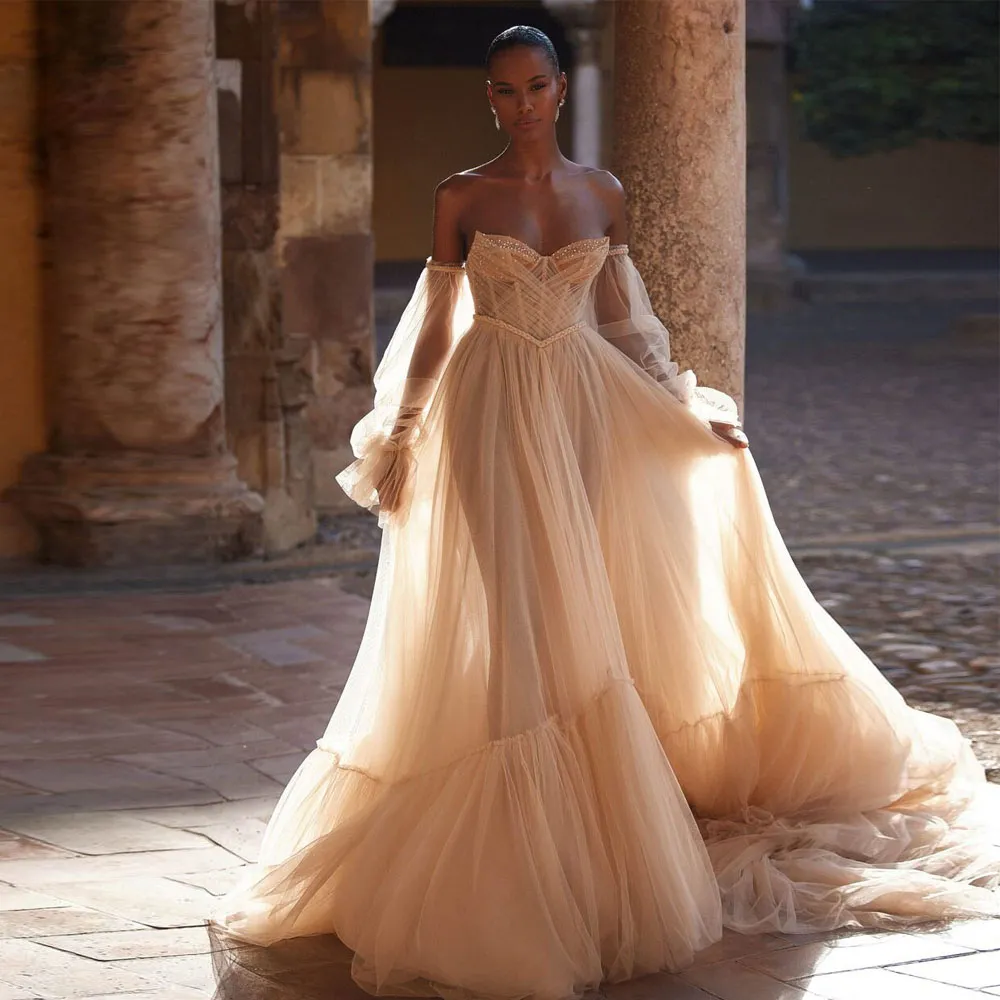 Abiti da sposa da spiaggia a trapezio Chamapgne Abito da sposa con perline a cuore Vedi attraverso maniche a sbuffo Tutu Maxi abiti per la sposa