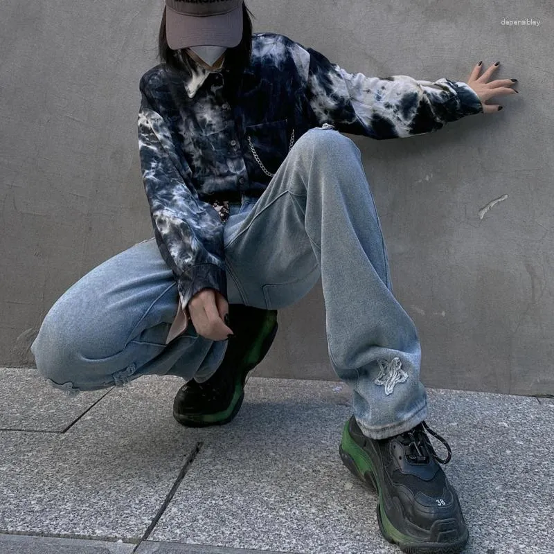 女性のジーンズパンクガールズファッションのトレンドは女性のためにリッピングされた日本のハラジュクストリートウェア10代のゴシック様式の服を着た脚デニムパンツ