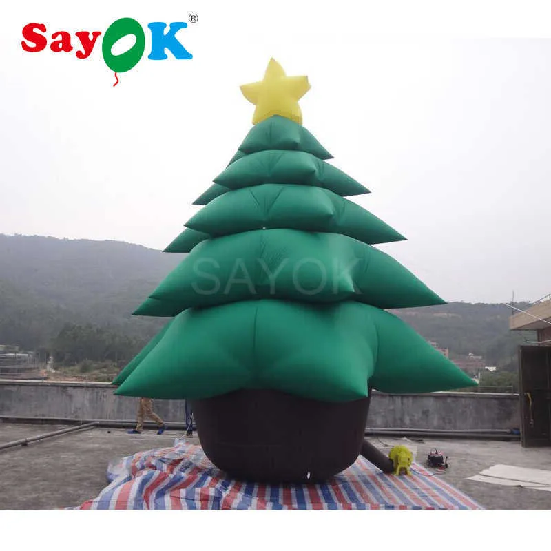 Gigantyczna nadmuchiwana choinka o wysokości 16,4 stóp z nadmuchiwanymi dekoracjami świątecznymi