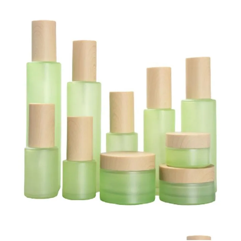 Botellas de embalaje Botella de vidrio verde esmerilado Frasco de crema facial Bomba de loción en aerosol de niebla fina Frascos de contenedores de cosméticos recargables 20Ml 30Ml 40M Otp08