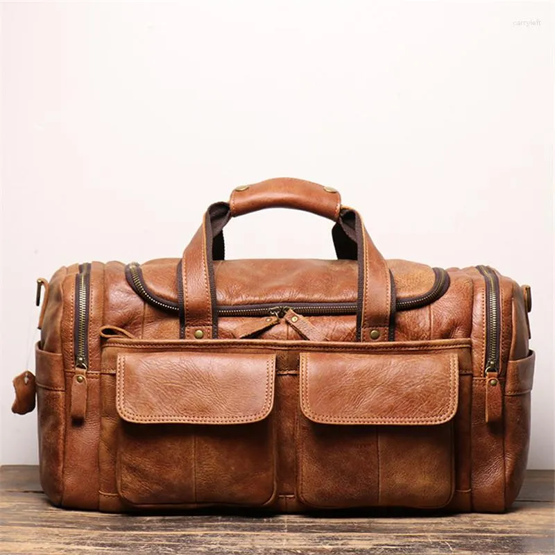 Duffelväskor stor kapacitet Vintage Brown Black Top Grain äkta läderföretag Män reseväska axel Messenger Duffle M0571