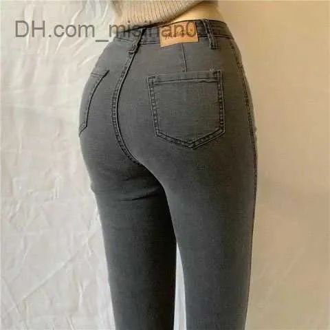 Jeans da donna in stile europeo e americano a vita alta glutei color pesca elastici pantaloni in denim glutei da donna sottili pantaloni a matita gamba piccola 2023 nuovi Z230728