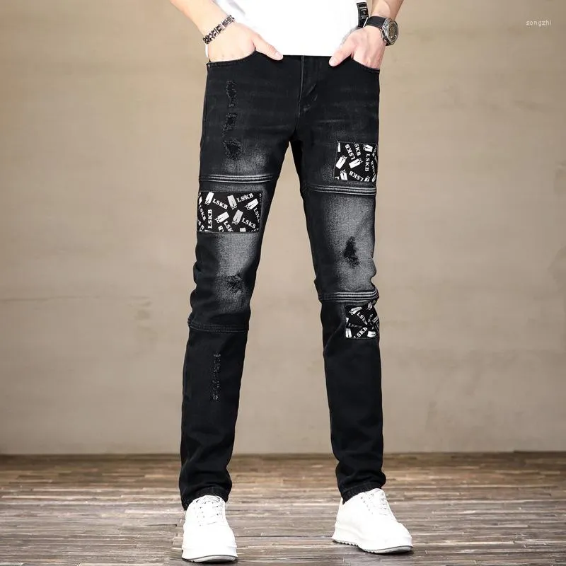 Мужские джинсы лето разорванные белые печатны