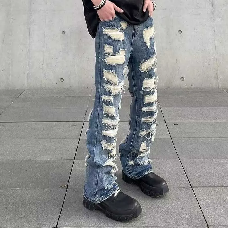 Jeans déchirés de rue de style américain unique Pantalon droit à la mode pour hommes