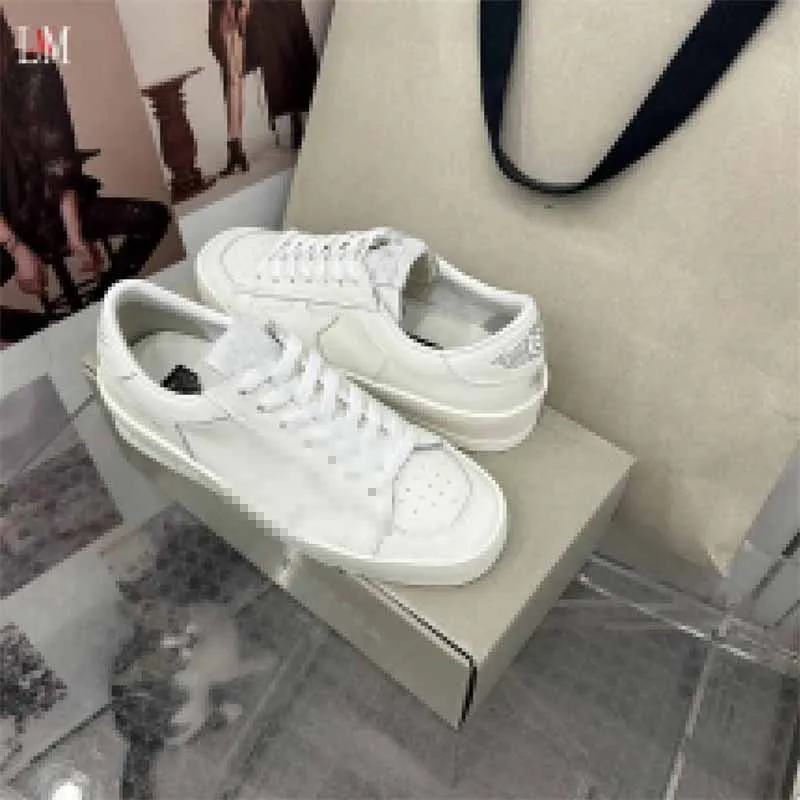 white shoes with gold stars