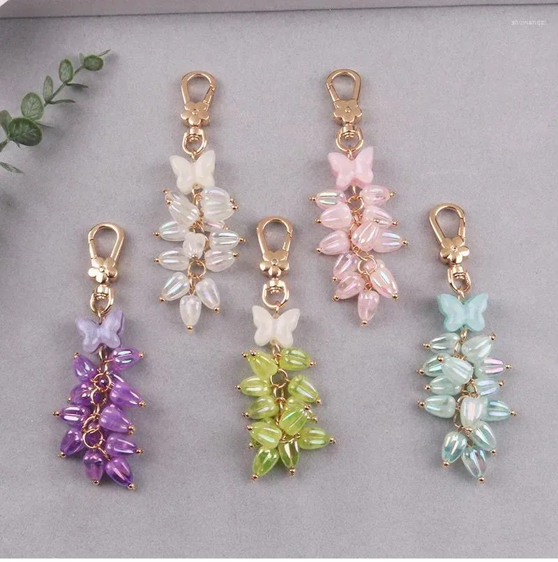 Keychains Creative Glitter Butterfly Plating Lily of the Valley Hanging Bead Key Ring Case Airpods Women Bag Car Pendant Keyring