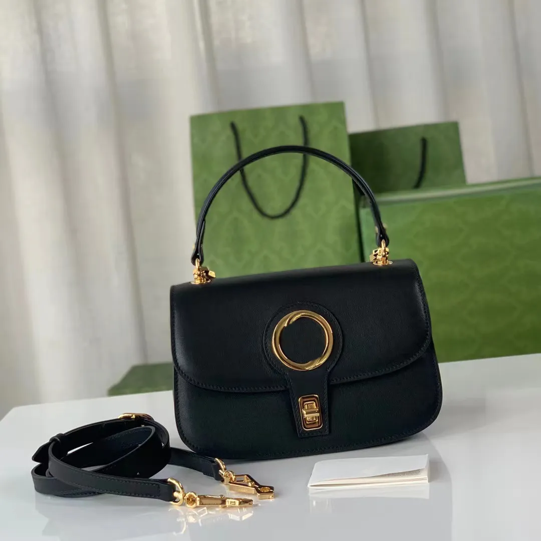 Circular interlocking design, handbag, brown leather with gold tone accessories, equipped with chain shoulder straps and leather shoulder straps.