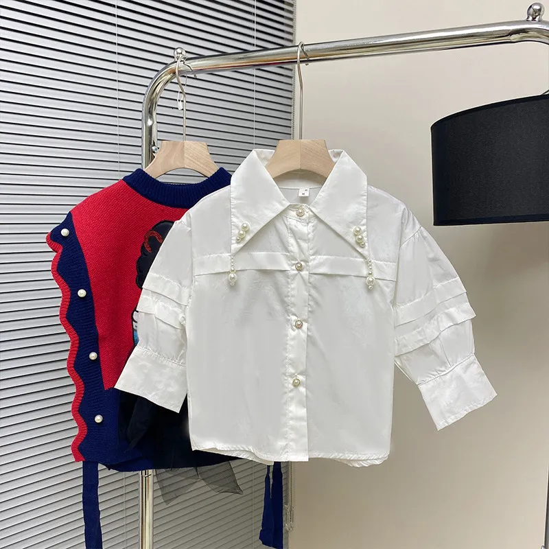 Kinderoverhemden Babi Girl Kleding Girl Kleding Herfst Children's Girls Lange Mouw Pearl hanger Polo Shirt Koreaanse mode Wit Kawaii T-shirt 230403