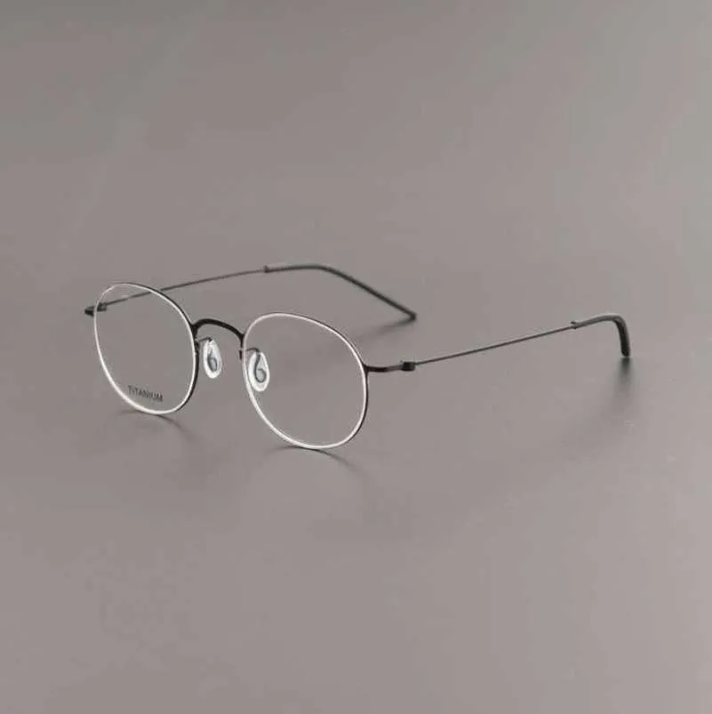 20 % de réduction pour les créateurs de luxe Lunettes sans vis La même monture ultra-légère en titane pur peut être équipée d'une lentille anti-bleu pour la myopie 5504