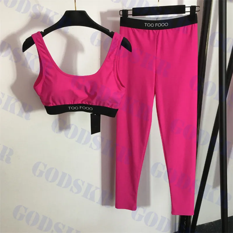 Yoga sätter designer rosa badkläder kvinnors sportunderkläder med bröstkuddar elastiska snäva leggings