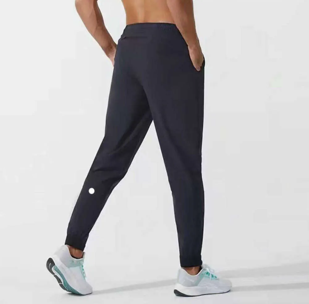 Lulu Men Pants Yogas Strój Longjogger Sport Szybki suchy sznurka gimnastyczna Kieszenie dresowe spodnie spodnie Męskie Elastyczne Waisretert