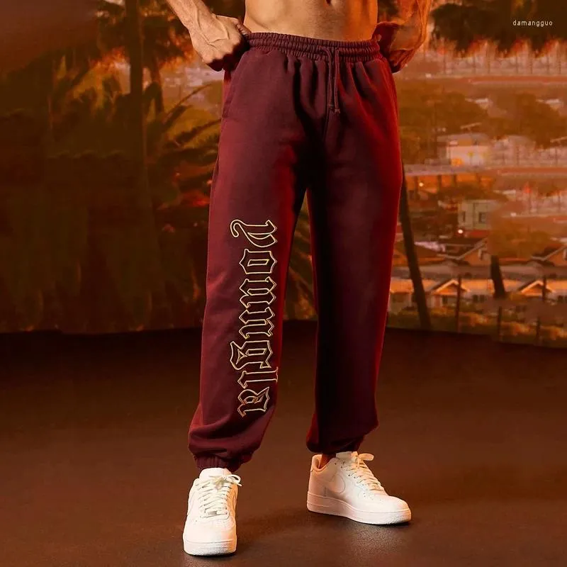 Pantaloni da uomo Jogging Palestra Sport Fitness Pantaloni sportivi Abbigliamento moda Pantaloni casual stile americano a vita media con coulisse