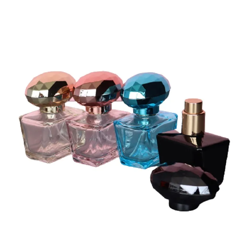 Botella recargable de perfume de vidrio Bomba de prensa de oro Spary 30 ml 1 oz Frascos de atomizador de perfume vacíos Envase de embalaje cosmético colorido cuadrado portátil