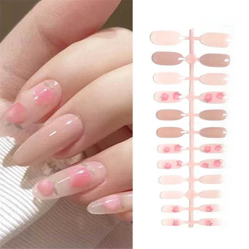 False unhas 24pcs Pressione em cor de pêssego rosa Cabeça oval de comprimento médio acabamento Produto de capa completa vestível Tip da unha para menina