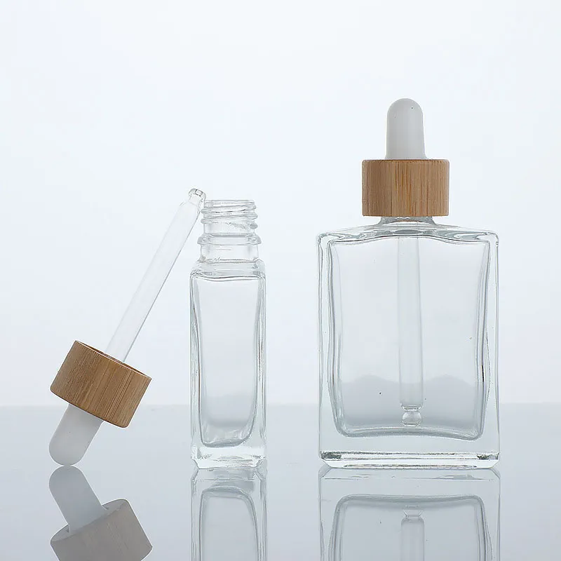 kwadratowy szklany szklany płaskie olejek na ramię butelka luksusa 30 ml 50 ml z bambusową pokrywką