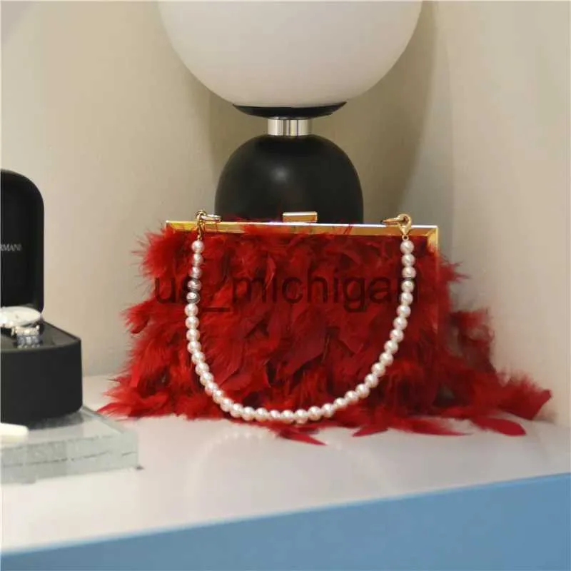 Red feather clutch bag hotsell