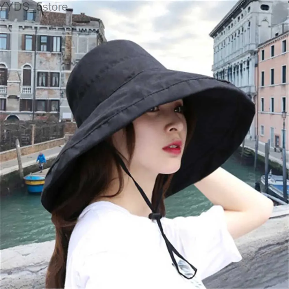 Szerokie brzegowe czapki wiadra czapki 1PC Summer Big Brim Sun Hat for Female Seaside Sun Ochrona UV Beach Cap Japanse Wild Fisherman Hat z wiatrakową liną prezenty YQ231110